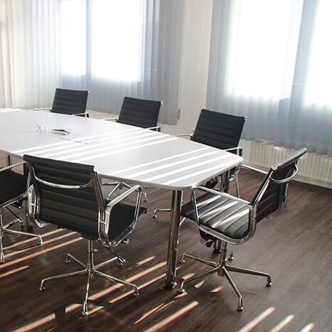 Applying a Protective Floor Sealant in New Meeting Room