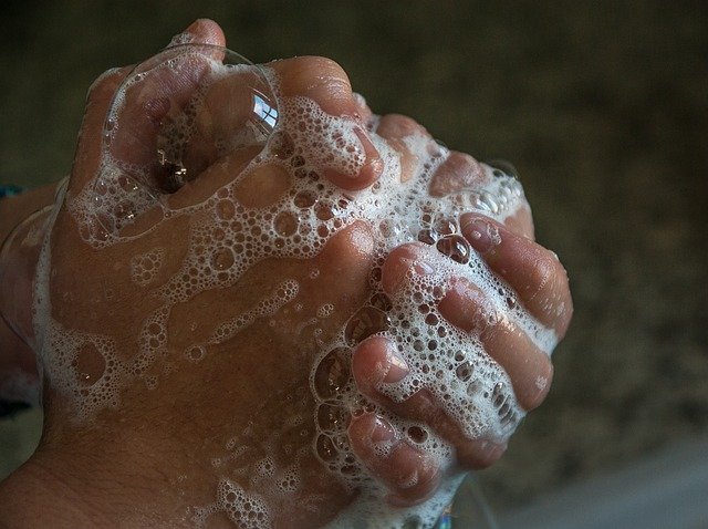 close up of hands washing with soap