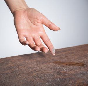 dust on worktop finger